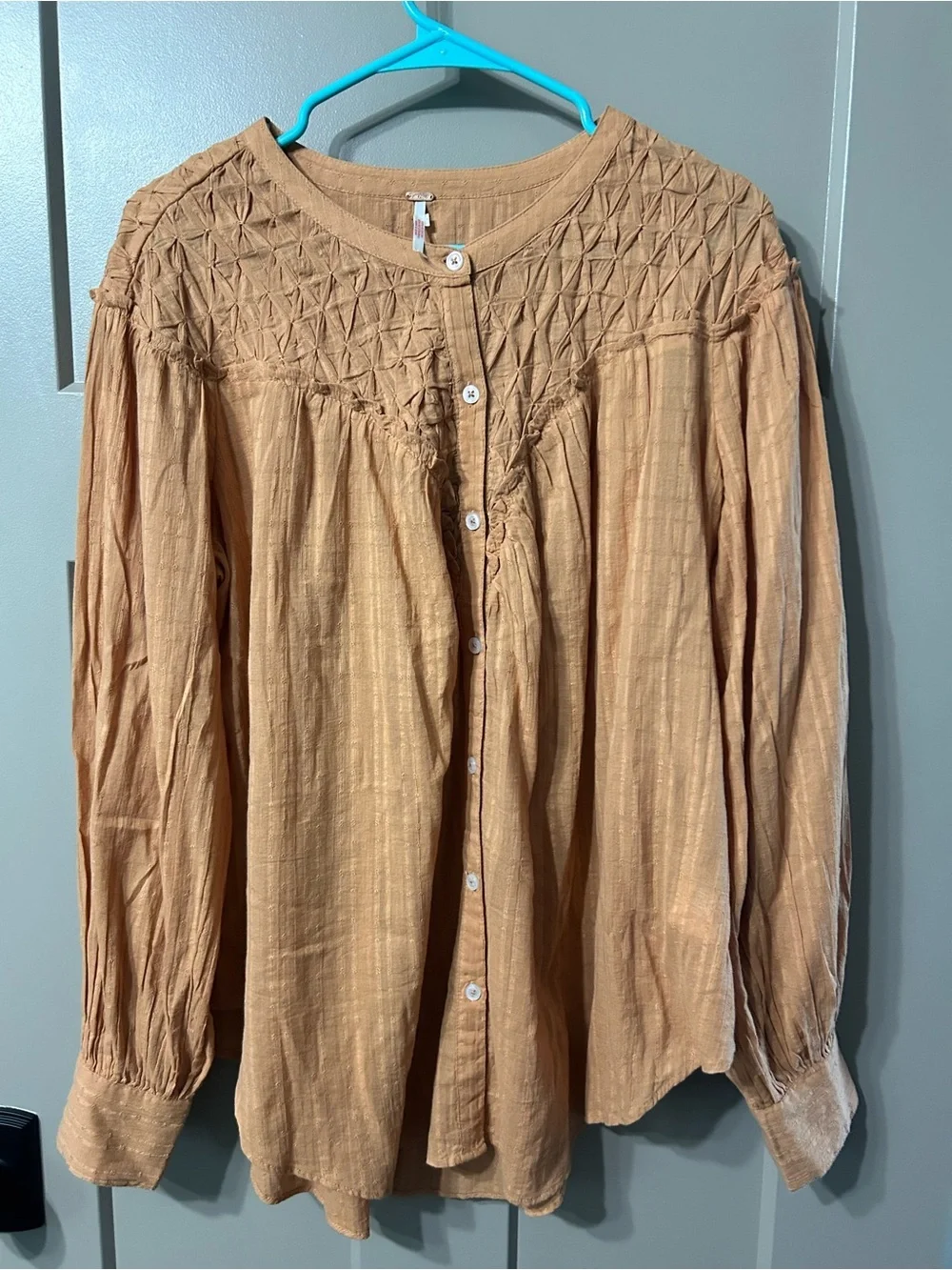Free People Marigold Button Down Top in a burnt orange color
